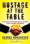 THE HOSTAGE AT THE TABLE
